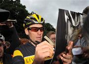25 August 2009; Seven times winner of the Tour de France Lance Armstrong signs autographs after his cycle in the Phoenix Park, Dublin. Picture credit: Brian Lawless  / SPORTSFILE