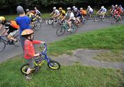 25 August 2009; Cycling fans look on as Lance Armstrong passes by in the Phoenix Park, Dublin. Picture credit: Brian Lawless  / SPORTSFILE