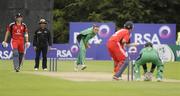 27 August 2009 ; Trent Johnston,  Ireland, bowls to Jonathan Trott, England before being caught behind. One Day Cricket International, Ireland v England, Stormont, Belfast, Co. Antrim. Picture credit: Oliver McVeigh / SPORTSFILE