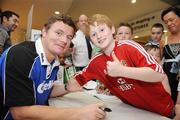 27 August 2009; As the rugby season gets set for kick-off Gillette Ambassador Brian O’Driscoll took part in a series of Dunnes Stores in-store signings much to the delight of the large crowd that packed the Blanchardstown and Cornelscourt stores. The in-store signings are part of a Gillette / Dunnes Stores promotion which is offering 50% off selected Gillette items including the new Gillette Gamer Razor. The Irish captain spent time with a host of delighted fans and will now turn his attention to the upcoming season. Pictured is Brian O'Driscoll with Christopher Hutchinson, age 9, from Blackhorse Avenue, Dublin. Dunnes Stores, Blanchardstown, Dublin. Picture credit: Brian Lawless / SPORTSFILE