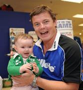 27 August 2009; As the rugby season gets set for kick-off Gillette Ambassador Brian O’Driscoll took part in a series of Dunnes Stores in-store signings much to the delight of the large crowd that packed the Blanchardstown and Cornelscourt stores. The in-store signings are part of a Gillette / Dunnes Stores promotion which is offering 50% off selected Gillette items including the new Gillette Gamer Razor. The Irish captain spent time with a host of delighted fans and will now turn his attention to the upcoming season. Pictured is Brian O'Driscoll with Lauren Weir, 9 months old, from Cabinteely. Dunnes Stores, Cornelscourt, Dublin. Picture credit: Brian Lawless / SPORTSFILE