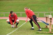 2 December 2015;  Munster's Billy Holland, left, and Keith Earls in conversation as they stretch before squad training. University of Limerick, Limerick. Picture credit: Diarmuid Greene / SPORTSFILE