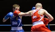 4 December 2015; Darryl Moran, Illies Golden Gloves Boxing Club, Buncrana, Co. Donegal, left, exchanges punches with Regan Buckley, St Teresa's Boxing Club, Co. Wicklow, during their 49kg semi-final bout. IABA National Elite Championships, National Boxing Stadium, Dublin. Picture credit: Piaras Ó Mídheach / SPORTSFILE