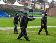 5 December 2015; Scotstoun Stadium grounds staff walk the pitch following the cancellation of the game, due to the weather conditions. Guinness PRO12, Round 9, Glasgow Warriors v Leinster. Scotstoun Stadium, Glasgow, Scotland. Picture credit: Stephen McCarthy / SPORTSFILE