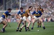 1 September 1991; Eddie O'Connor, Kilkenny, in action against Pat Fox, left, and Conor Stakelum, Tipperary. All-Ireland Senior Hurling Final, Tipperary v Kilkenny, Croke Park. Picture Credit: Ray McManus / SPORTSFILE