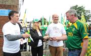 30 August 2009; Managing Director of Renault Ireland Bill Cullen, left, Olivia Buckley, Director of We Belong and former Kerry player Jack O'Shea, canvass for a yes vote in the upcoming Lisbon treaty outside Croke Park. GAA Football All-Ireland Senior Championship Semi-Final, Kerry v Meath, Croke Park, Dublin. Picture credit: Dáire Brennan / SPORTSFILE