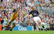30 August 2009; Colm Cooper, Kerry, scores a point in the first half despite the efforts of Eoghan Harrington, Meath. GAA All-Ireland Senior Football Championship Semi-Final, Kerry v Meath, Croke Park, Dublin. Picture credit; Dáire Brennan / SPORTSFILE