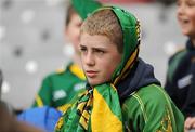 30 August 2009; A Kerry supporter uses a flag to shelter from the rain during the game. GAA Football All-Ireland Senior Championship Semi-Final, Kerry v Meath, Croke Park, Dublin. Picture credit: Pat Murphy / SPORTSFILE