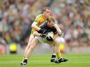 30 August 2009; Marc O Se, Kerry, is tackled by Nigel Crawford, Meath. GAA All-Ireland Senior Football Championship Semi-Final, Kerry v Meath, Croke Park, Dublin. Picture credit: Ray McManus / SPORTSFILE