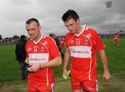 21 June 2009; A dejected Paddy Bradley and Eoin Bradley, Derry, walk off the pitch after the game. GAA Football Ulster Senior Championship Semi-Final, Tyrone v Derry, Casement Park, Belfast, Co. Antrim. Picture credit: Oliver McVeigh / SPORTSFILE