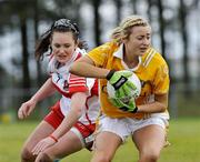 29 August 2009; Eimear Kelly, Antrim, in action against Grace Conway, Derry. TG4 All-Ireland Ladies Football Junior Championship Semi-Final, Antrim v Derry, Wolfe Tones GAA Club, Kildress, Co. Tyrone. Picture credit: Michael Cullen / SPORTSFILE