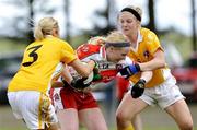 29 August 2009; Michelle McAteer, Derry, in action against Eimear Kelly, 3, and Catherine Mullan, Antrim. TG4 All-Ireland Ladies Football Junior Championship Semi-Final, Antrim v Derry, Wolfe Tones GAA Club, Kildress, Co. Tyrone. Picture credit: Michael Cullen / SPORTSFILE