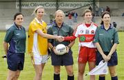 29 August 2009; Antrim captain Geraldine McCann and Derry captain Louise Glass shake hands in the presence of referee Tony Lennon, Eadaoin O'Kane, far left, and Martina Dillon. TG4 All-Ireland Ladies Football Junior Championship Semi-Final, Antrim v Derry, Wolfe Tones GAA Club, Kildress, Co. Tyrone. Picture credit: Michael Cullen / SPORTSFILE