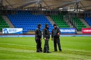 5 December 2015; Scotstoun Stadium grounds staff walk the pitch following the cancellation of the game, due to the weather conditions. Guinness PRO12, Round 9, Glasgow Warriors v Leinster. Scotstoun Stadium, Glasgow, Scotland. Picture credit: Stephen McCarthy / SPORTSFILE