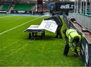 5 December 2015; Scotstoun Stadium grounds staff remove the perimeter advertisements following the cancellation of the game, due to the weather conditions. Guinness PRO12, Round 9, Glasgow Warriors v Leinster. Scotstoun Stadium, Glasgow, Scotland. Picture credit: Stephen McCarthy / SPORTSFILE