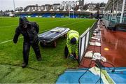 5 December 2015; Scotstoun Stadium grounds staff remove the perimeter advertisements following the cancellation of the game, due to the weather conditions. Guinness PRO12, Round 9, Glasgow Warriors v Leinster. Scotstoun Stadium, Glasgow, Scotland. Picture credit: Stephen McCarthy / SPORTSFILE