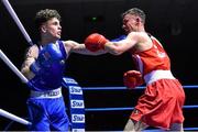 5 December 2015; Brendan Irvine, St Pauls, Antrim, right, trades punches with William Donohue, St Michaels, Athy, during their 52kg bout.. IABA National Elite Championships. National Boxing Stadium, Dublin. Picture credit: Ramsey Cardy / SPORTSFILE