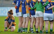 6 December 2015; Aoife Corcoran, Cahir, ties her boots before the start of the game. All-Ireland Ladies Intermediate Club Championship Final, Cahir v Milltown. Parnell Park, Dublin. Picture credit: David Maher / SPORTSFILE