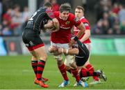 6 December 2015; Dave O'Callaghan, Munster, is tackled by Lewis Evans and Adam Warren, Newport Gwent Dragon. Guinness PRO12, Round 9, Newport Gwent Dragons v Munster. Rodney Parade, Newport, Wales. Picture credit: Gareth Everett / SPORTSFILE