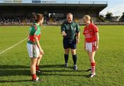 29 August 2009; Referee Keith Delahunty tosses the coin between captains Martha Carter, left, Mayo and Mary O'Connor, Cork. TG4 All-Ireland Ladies Football Senior Championship Semi-Final, Cork v Mayo, McDonagh Park, Nenagh, Co. Tipperary. Picture credit: Brendan Moran / SPORTSFILE