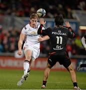 11 December 2015; Andrew Trimble, Ulster, kicking the ball past Maxime Médard, Toulouse in the move that lead to his and Ulsters second try. European Rugby Champions Cup, Pool 1, Round 3, Ulster v Toulouse. Kingspan Stadium, Ravenhill Park, Belfast. Picture credit: Oliver McVeigh / SPORTSFILE