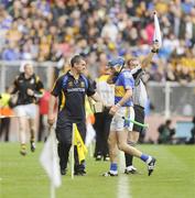 6 September 2009; Tipperary manager Liam Sheedy with Benny Dunne as he makes his way off the field after receiving a red card. GAA Hurling All-Ireland Senior Championship Final, Kilkenny v Tipperary, Croke Park, Dublin. Picture credit: Oliver McVeigh / SPORTSFILE