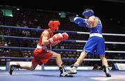 9 September 2009; John Joe Nevin, right, Ireland, in action against Yu Gu, China, during their Bantamweight 54kg bout. AIBA World Boxing Championships, Quarter-Finals, Assago, Milan, Italy. Picture credit: David Maher / SPORTSFILE