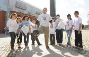 10 September 2009; Actor Gary Cooke of Apres Match shows off his soccer skills in front of 5th class students from Griffeen Valley Educate Together School, Lucan, Dublin, from left, Petra Haraszti, Louise Monaghan, Neola Gavril, Arslan Boulafrad, Naoise Barry, Evan Roy, Nadia Khan and Ajeet Bisht at the launch of the SARI Soccerfest meets Concern KiteFest Festival. Smithfield Square, Smithfield, Dublin. Picture Credit: Pat Murphy / SPORTSFILE