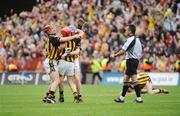 6 September 2009; Referee, Diarmuid Kirwan, tries to retrieve the sliothar from, Tommy Walsh, as he celebrates with team-mates Eoin Larkin, left, and T.J. Reid after the game. GAA Hurling All-Ireland Senior Championship Final, Kilkenny v Tipperary, Croke Park, Dublin. Picture credit: Brian Lawless / SPORTSFILE