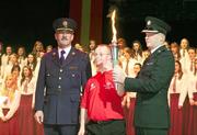 10 September 2009; Special Olympics athlete John Paul Doyle, from Kerry Stars Special Olympics Club, arrives with the Special Olympics torch accompanied by Deputy Commissioner of An Garda Siochana Nacie Rice, left, and Supt Peter Loughins of the PSNI, at the launch of the 2010 Special Olympics Ireland Games. The Games will take place in Limerick from 9-13th June. Nineteen hundred athletes will participate in 4 days of sporting competition in venues throughout Limerick. The Games will be supported by a team of 3,500 volunteers who will be recruited over the coming months. Concert Hall, Limerick University, Limerick. Picture Credit: Kieran Clancy / SPORTSFILE