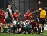 12 December 2015; Munster players celebrate after referee Romain Poite awards the try to Munster's James Cronin, hidden. European Rugby Champions Cup, Pool 4, Round 3, Munster v Leicester Tigers. Thomond Park, Limerick. Picture credit: Matt Browne / SPORTSFILE