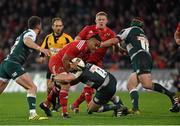 12 December 2015; Francis Saili, Munster, is tackled by, Tom Youngs and Marcos Ayerza, right, Leicester Tigers. European Rugby Champions Cup, Pool 4, Round 3, Munster v Leicester Tigers. Thomond Park, Limerick. Picture credit: Diarmuid Greene / SPORTSFILE