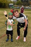 12 December 2015; Waterford's Noel Connors with six year old Gavin O'Halligan during a Celtic Cowboys coaching session. All-Star Tour 2015, sponsored by Opel. McEachern Field, Austin, Texas, USA. Picture credit: Ray McManus / SPORTSFILE