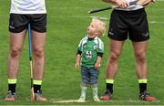 13 December 2015; Two year old Eoin Moriarty, a member of the host club, looks up at David O'Callaghan and Kieran Bergin as the teams are introduced. GAA All-Star Tour 2015, sponsored by Opel, 2014 All-Stars v 2015 All-Stars. St Edward’s University, Austin, Texas, USA. Picture credit: Ray McManus / SPORTSFILE