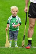 13 December 2015; Two year old Eoin Moriarty, a member of the host club, stands beside Kieran Bergin as the teams are introduced. GAA All-Star Tour 2015, sponsored by Opel, 2014 All-Stars v 2015 All-Stars. St Edward’s University, Austin, Texas, USA. Picture credit: Ray McManus / SPORTSFILE