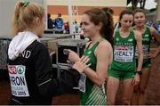 13 December 2015; Ireland's Sophie Murphy is greeted by team-mate Isabel Carron after finishing the Junior Women's event. SPAR European Cross Country Championships Hyeres 2015. Paray Le Monial, France Picture credit: Cody Glenn / SPORTSFILE