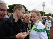 13 December 2015; Ireland's Ciara Durkan is greeted by her family after winning team bronze in the Senior Women's event. SPAR European Cross Country Championships Hyeres 2015. Paray Le Monial, France Picture credit: Cody Glenn / SPORTSFILE