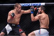 12 December 2015; Urijah Faber, left, in action against Frankie Saenz during their bantamweight bout. UFC 194: Undercard, MGM Grand Garden Arena, Las Vegas, USA. Picture credit: Ramsey Cardy / SPORTSFILE