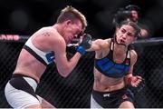 12 December 2015; Tecia Torres in action against Jocelyn Jones-Lybarger during their strawweight bout. UFC 194: Undercard, MGM Grand Garden Arena, Las Vegas, USA. Picture credit: Ramsey Cardy / SPORTSFILE