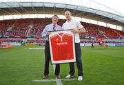 11 September 2009; Munster's Paul O'Connell makes a presentation of a signed jersey to former squad Doctor Mick Shinkwin before the game. Celtic League, Munster v Cardiff Blues, Thomond Park, Limerick. Picture credit: Diarmuid Greene / SPORTSFILE
