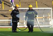 12 September 2009; Members of Dublin Civil Defence water the pitch before the start of the game. FAI Ford Cup Quarter-Final, Sporting Fingal v Shamrock Rovers, Morton Stadium, Santry, Dublin. Photo by Sportsfile
