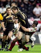 12 September 2009; Andrew Bishop, Ospreys, is tackled by Willie Faloon, Ulster. Celtic League, Ospreys v Ulster, Liberty Stadium, Swansea, Wales. Picture credit: Steve Pope / SPORTSFILE