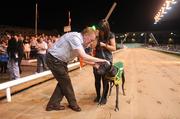12 September 2009; Owner Mike McKenna and Sarah Buckley, daughter of trainer Pat Buckley, congratulate College Causeway after winning the paddypower.com Irish Greyhound Derby Final. paddypower.com Irish Greyhound Derby, Shelbourne Park, Dublin. Picture credit: Stephen McCarthy / SPORTSFILE