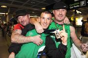 13 September 2009; Boxer John Joe Nevin with his uncle Micko, left, and father Murphy on his return to Dublin Airport after winning the Bronze Medal at the 2009 AIBA World Boxing Championships Final in Assago, Milan, Italy. Dublin Airport, Dublin. Picture credit: David Maher / SPORTSFILE