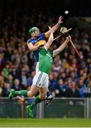 21 June 2015; Niall O'Meara, Tipperary, fields a high ball ahead of Seamus Hickey, Limerick. Munster GAA Hurling Senior Championship, Semi-Final, Limerick v Tipperary, Gaelic Grounds, Limerick. Picture credit: Brendan Moran / SPORTSFILE