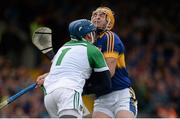21 June 2015; Seamus Callanan, Tipperary, clashes with Limerick goalkeeper Barry Hennessy, in which Callanan lost 3 teeth and left the pitch for a blood injury before returning late in the game. Munster GAA Hurling Senior Championship, Semi-Final, Limerick v Tipperary, Gaelic Grounds, Limerick. Picture credit: Brendan Moran / SPORTSFILE