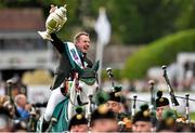 7 August 2015; Greg Patrick Broderick, Ireland, celebrates with the Aga Khan trophy after his team's victory in the Furusiyya FEI Nations Cup during the Discover Ireland Dublin Horse Show 2015. RDS, Ballsbridge, Dublin. Picture credit: Cody Glenn / SPORTSFILE