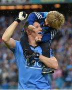 20 September 2015; Dublin's Darren Daly celebrates with his son Caolán, age 4, after the game. GAA Football All-Ireland Senior Championship Final, Dublin v Kerry, Croke Park, Dublin. Picture credit: Brendan Moran / SPORTSFILE