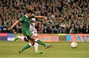 8 October 2015; Shane Long, Republic of Ireland, shoots past Germany goalkeeper Manuel Neuer to score his side's first goal despite the attempts of Jérôme Boateng. UEFA EURO 2016 Championship Qualifier, Group D, Republic of Ireland v Germany. Aviva Stadium, Lansdowne Road, Dublin. Picture credit: David Maher / SPORTSFILE