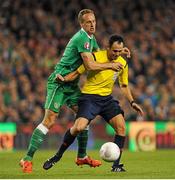 8 October 2015; David Meyler, Republic of Ireland, collides with referee Carlos Velasco Carballo. UEFA EURO 2016 Championship Qualifier, Group D, Republic of Ireland v Germany. Aviva Stadium, Lansdowne Road, Dublin. Picture credit: Seb Daly / SPORTSFILE